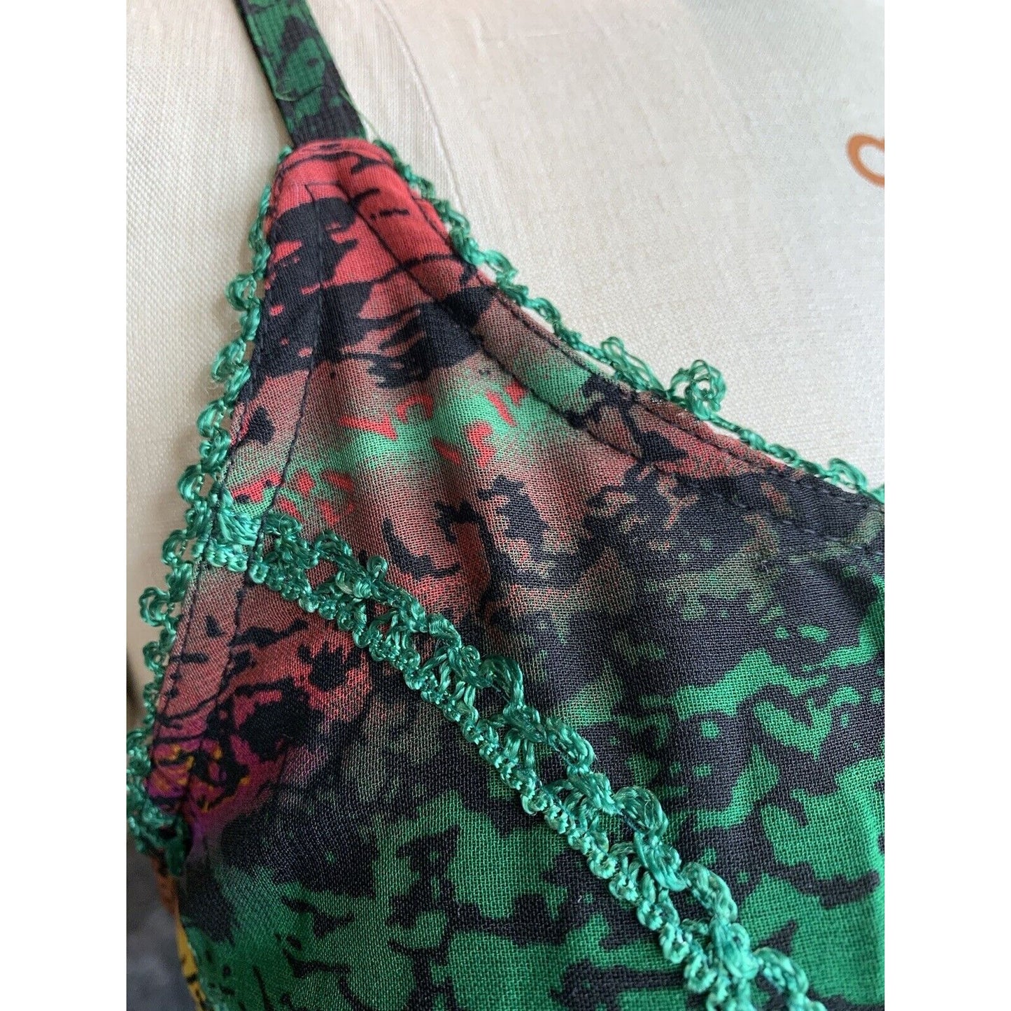 Closeup Of Green Trim On Green Abstract Animal Print Corset Handkerchief Dress