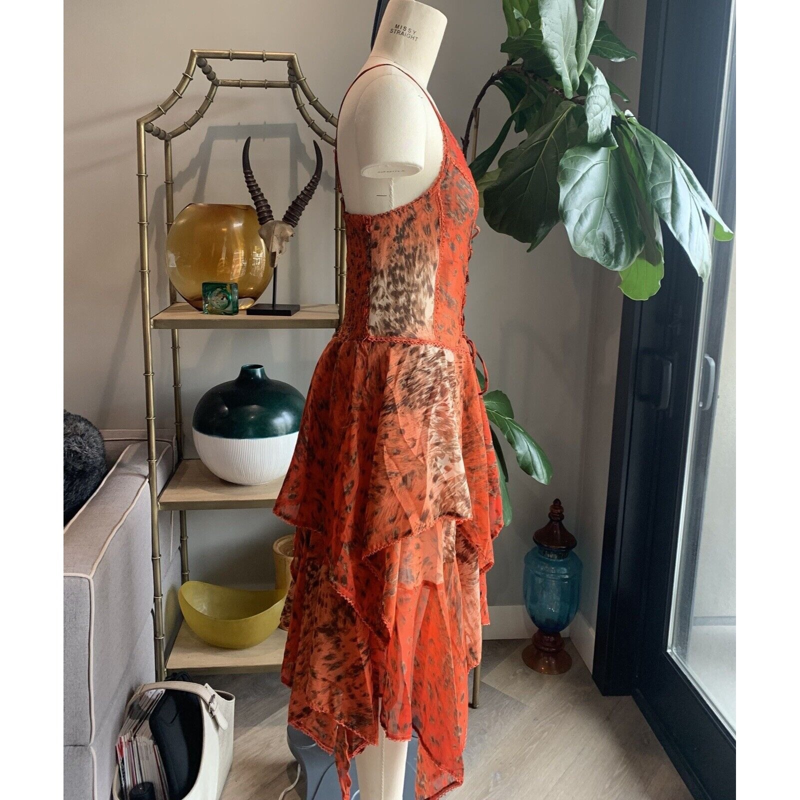 Side View Of Orange Abstract Animal Print Corset Handkerchief Dress