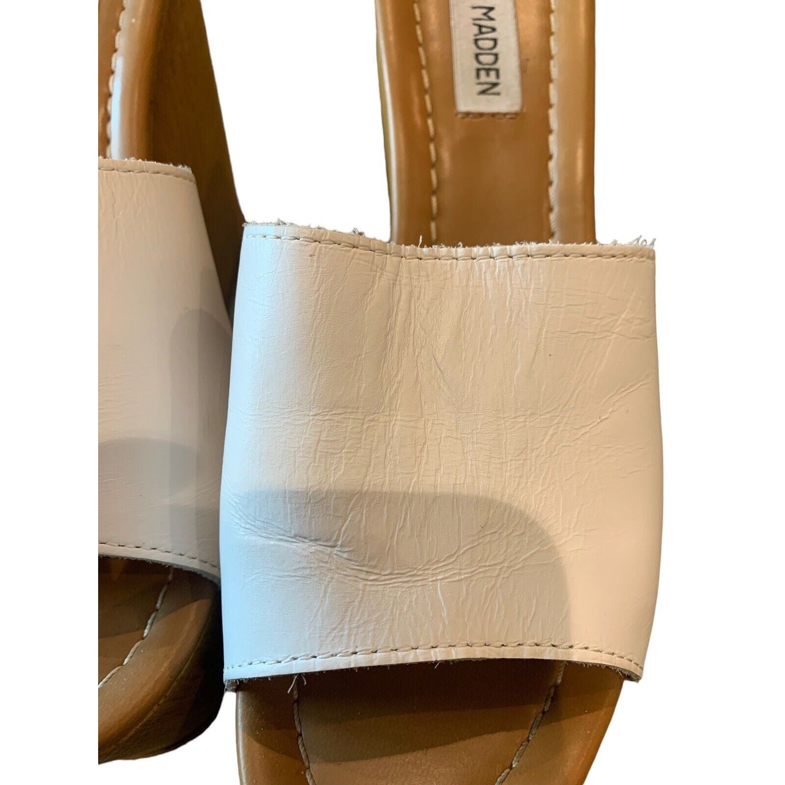 Closeup Of Women's White Leather Wedge And Platform Sandal