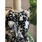 Closeup Of Bust Of Floral With Stripe Boarder Halter Style Maxi Dress