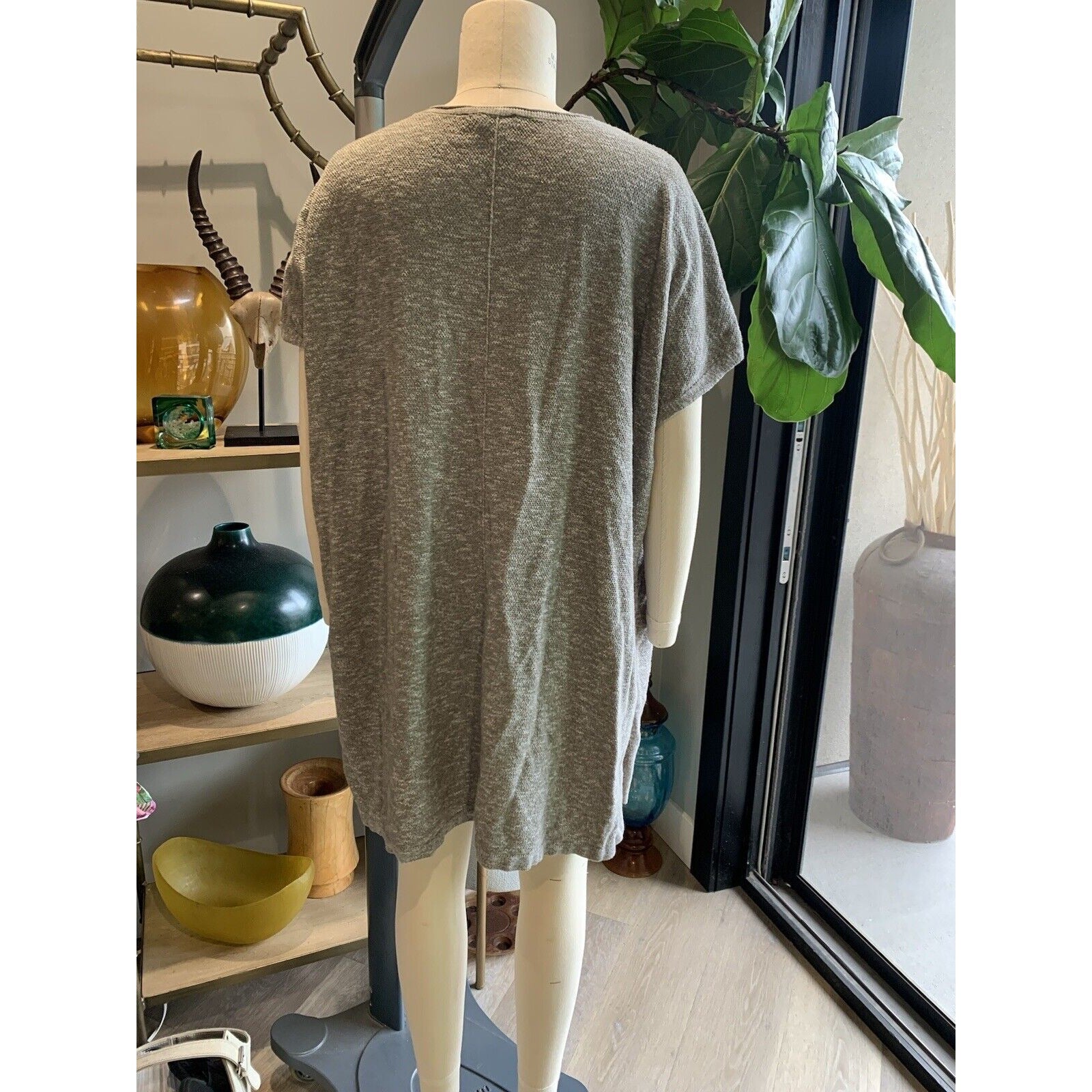 Rear View Of Women's Marled Tunic Sweater