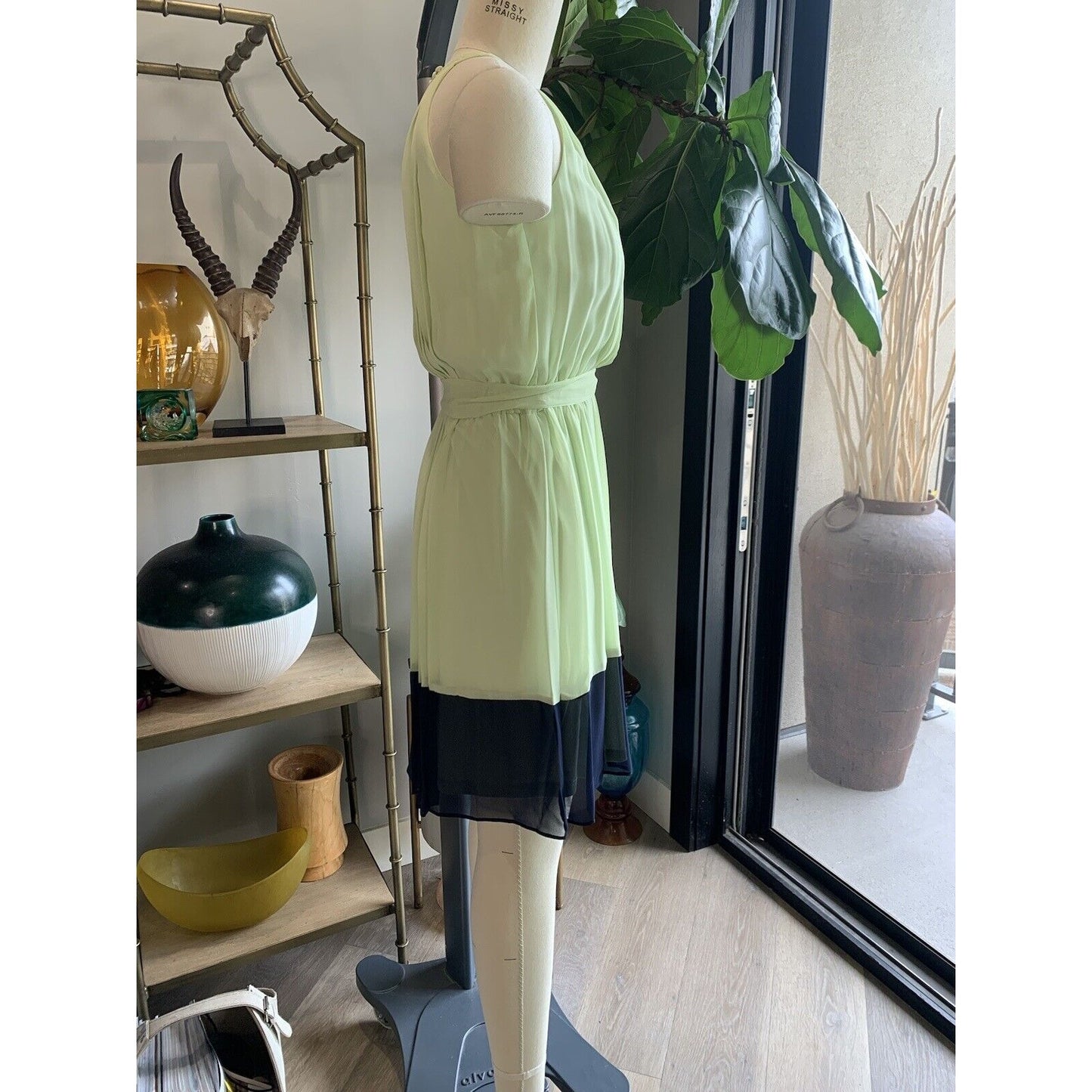 Side View Of Pleated And Color-Blocked Sleeveless Dress