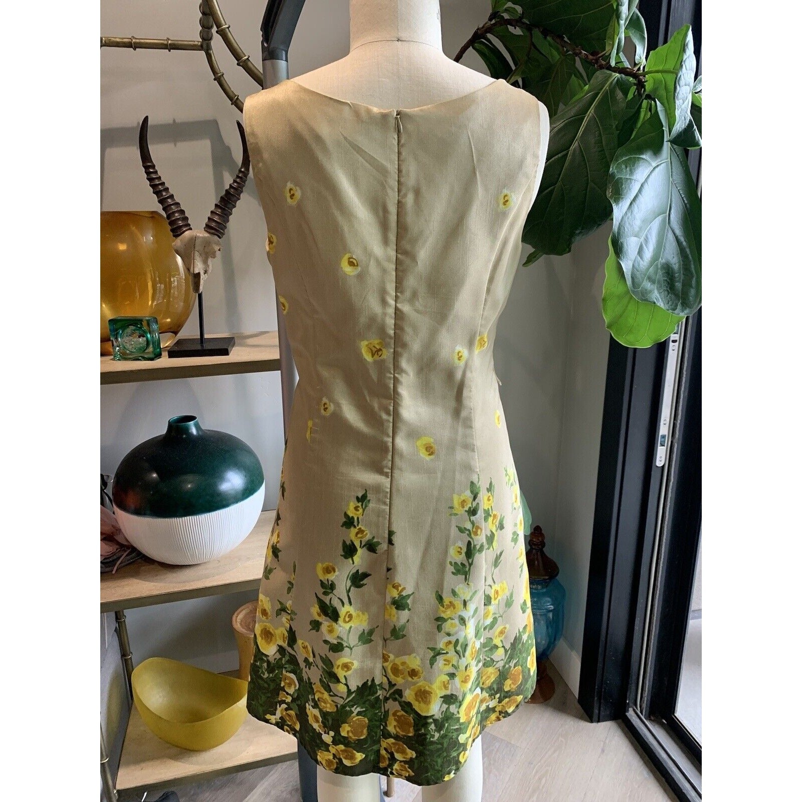 Rear View Of Tan And Floral Cocktail Dress