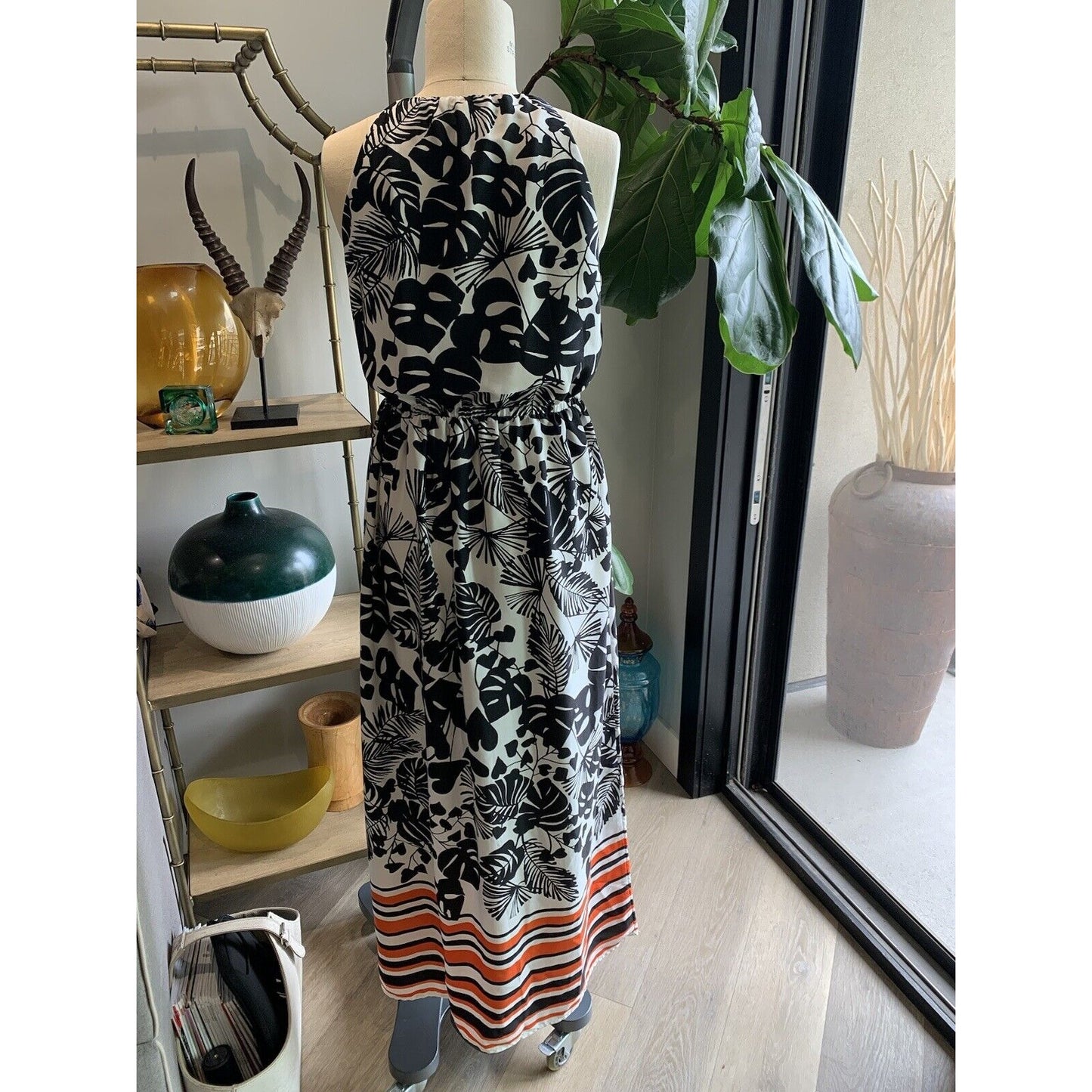 Back View Of Floral With Stripe Boarder Halter Style Maxi Dress