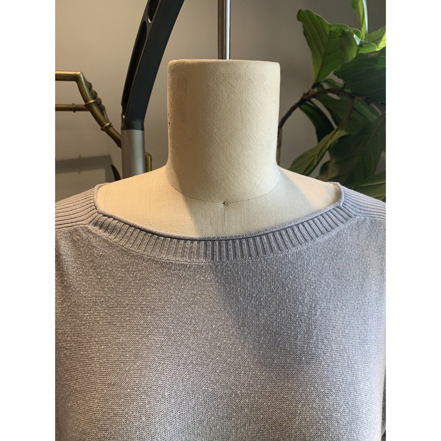 Closeup Of Neckline Of Women's Knit Tunic Sweater