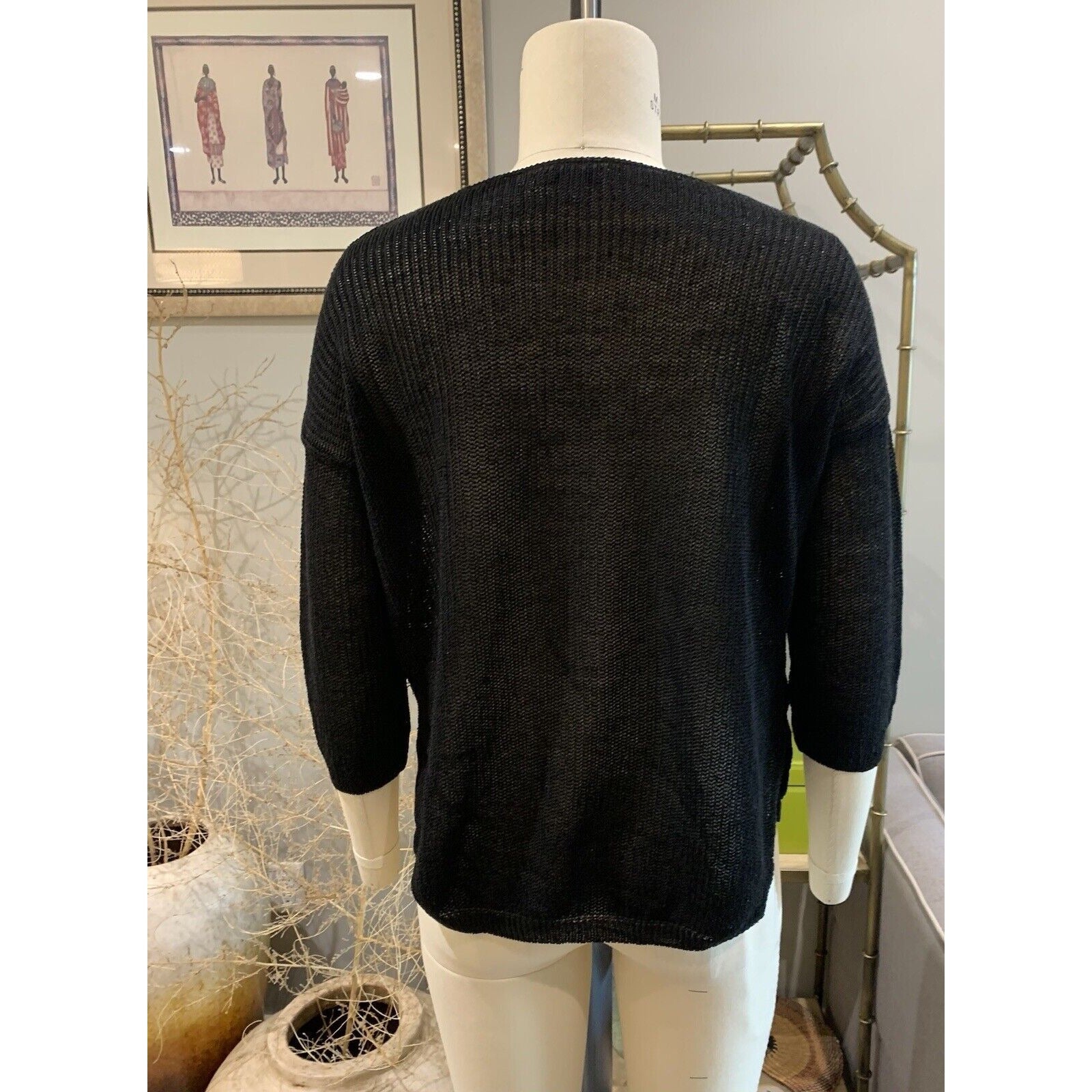 Rear View Of Women's Black Knit Sweater 