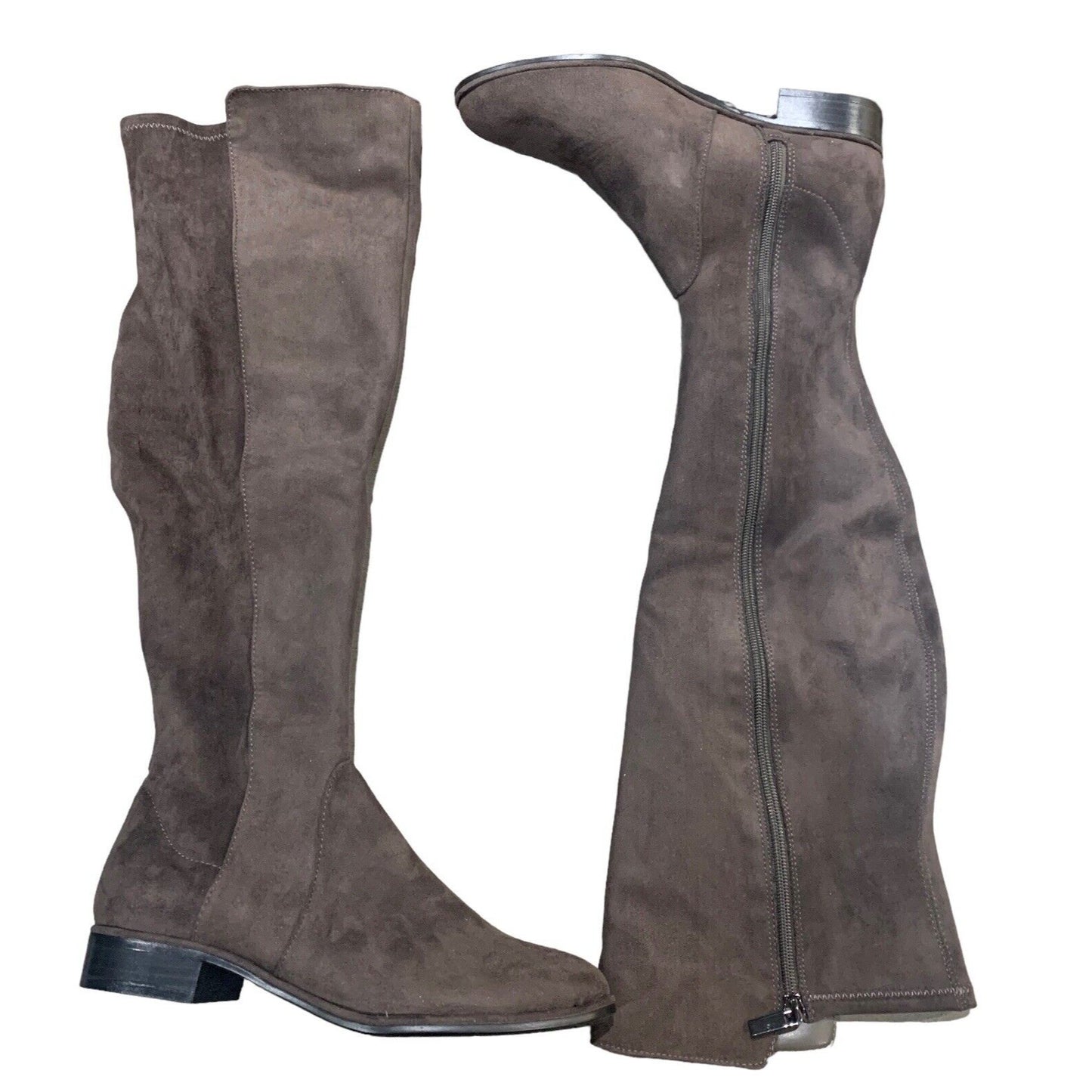 one knee high boot displayed right side up and one knee high boot displayed upside down