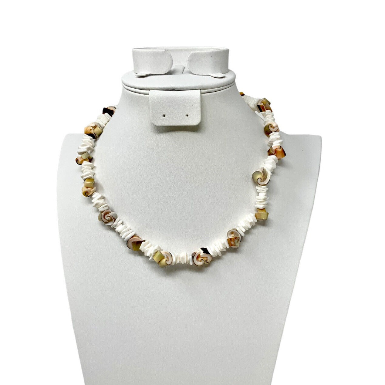 Brown and Egg-Shell Colored Shell Necklace Displayed on a Bust on a White Background