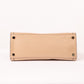 Bottom View Of Large Beige Leather Handbag with Gold Hardware