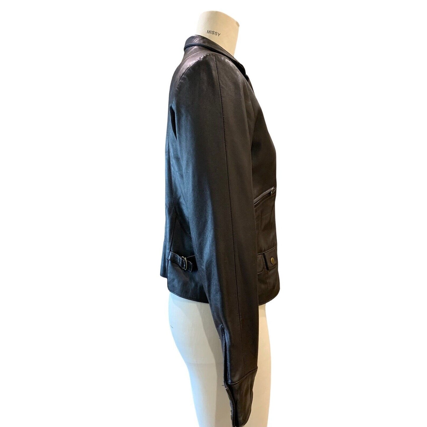 Side view of women's short leather jacket