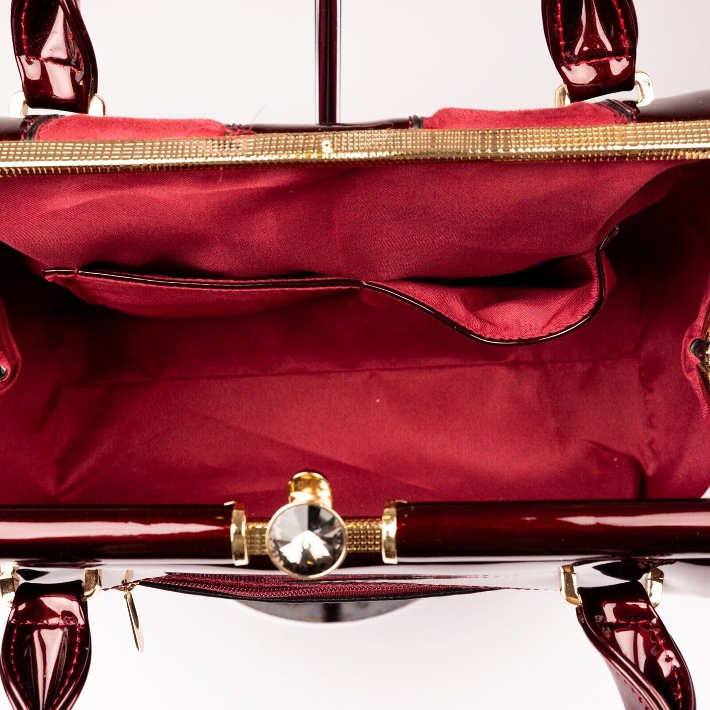 Inside View Of Ruby Red Patent Leather and Faux Suede Handbag